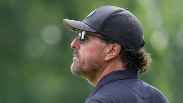 Phil Mickelson looks on from the eighth green during the first round of the U.S. Open golf tournament.